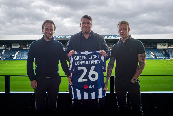 Green Light Consultancy Group team holding a West Brom shirt at The Hawthorns